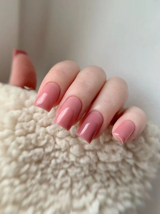 Nails finished with Base One Brush One Bottle Gel (15g) in Nothing Special, displaying a smooth, opaque pink manicure with warm, terracotta undertones.
