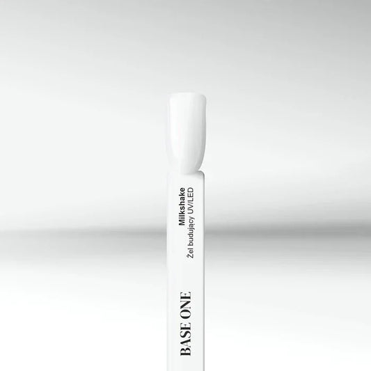 A close-up product swatch of Silcare Base One Builder Gel in the shade 'Milkshake,' showing a semi-opaque milky white finish on a professional nail display stick against a clean, white background. Base One Builder gel milkshake Silcare.