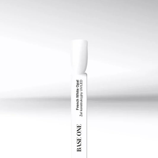 Cured nail tip displaying the opaque, striking cold white color of the Base One French White Opal UV builder gel (15g), perfect for flawless French tips.