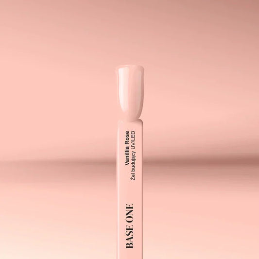 Cured nail tip displaying the opaque, soft Vanillia Rose color of the Base One UV builder gel (15g), perfect for a gentle, natural French base.