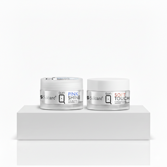 Two jars of Silcare Quin Nail Butter, Pink Shine and Soft Touch, displayed as a manicure bundle on a white podium. High-quality professional nail care and cuticle treatment products for salon-quality results.