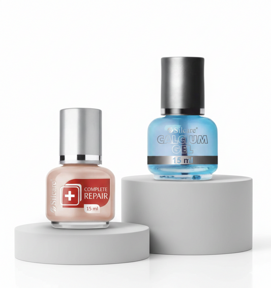 Complete Repair and Calcium Gel nail treatment bottles on display pedestals - Silcare