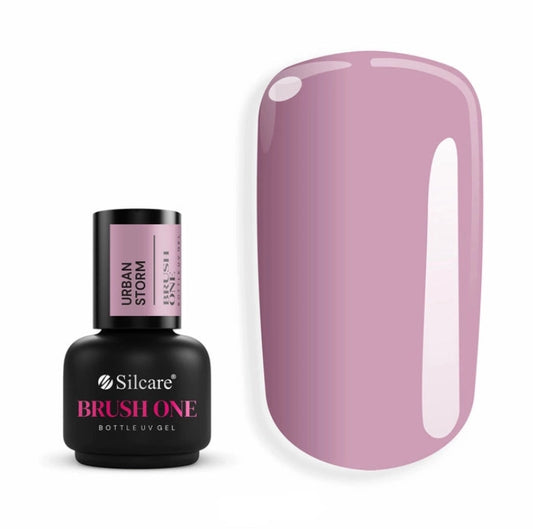 Silcare Brush One Urban Storm BIAB Builder Gel bottle displayed beside a glossy nail colour swatch in a sophisticated muted lilac-grey shade. Professional self-levelling builder gel with a cool-toned mauve finish, ideal for natural nail strengthening, overlays and elegant modern manicures.