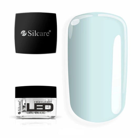 Silcare High Light LED Blue UV/LED builder gel jar with black lid displayed beside a large pastel blue colour swatch, showcasing a translucent icy blue finish with a smooth glossy surface. Professional self-levelling builder gel for salon-quality nail extensions, overlays and natural nail strengthening – Silcare Australia.