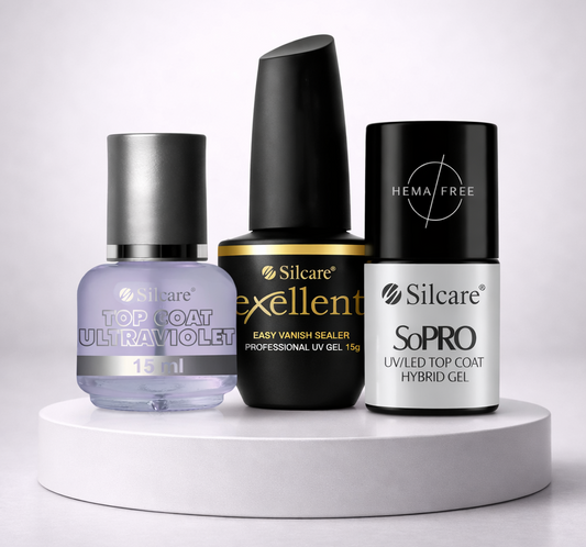 Three Silcare professional nail top coats on a white pedestal: Top Coat Ultraviolet, Exellent Easy Vanish Sealer UV Gel, and SoPRO HEMA-free UV/LED Hybrid Gel Top Coat.
