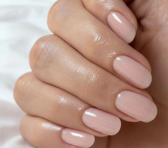 Nails finished with Base One Brush One Bottle Gel (15g) in Ash Blush, displaying a smooth, cool-toned dusty rose with beige manicure for elegant, opaque coverage.