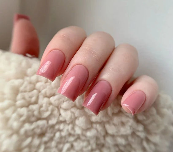 Nails finished with Base One Brush One Bottle Gel (15g) in Nothing Special, displaying a smooth, opaque pink manicure with warm, terracotta undertones.