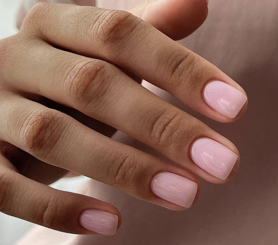 Nails finished with Base One Brush One Bottle Gel (15g) in Rose Rebel, displaying a smooth, rich, opaque rose pink manicure for a bold look.