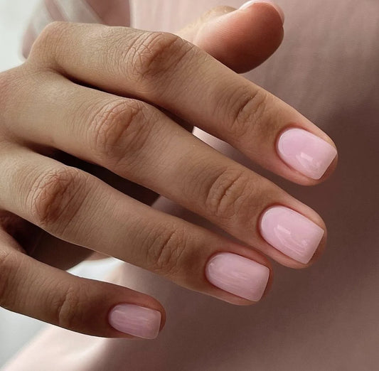 Nails finished with Base One Brush One Bottle Gel (15g) in Rose Rebel, displaying a smooth, rich, opaque rose pink manicure for a bold look.