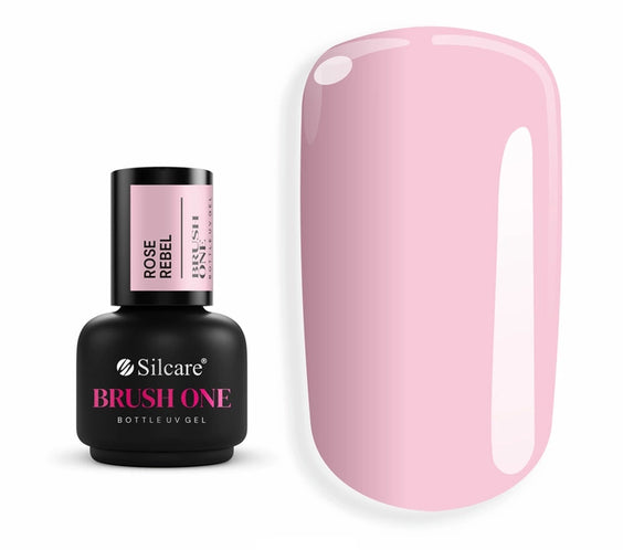 Brush One Bottle Gel (15g) in Rose Rebel, set next to a large nail tip, displaying the opaque, rich, deep rose pink color sample.