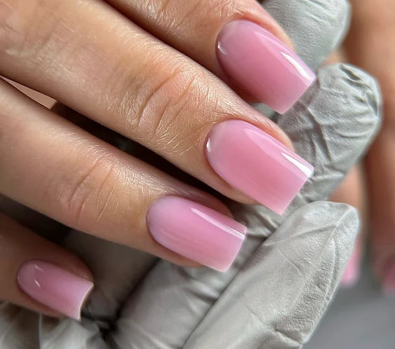 Nails finished with Base One Brush One Bottle Gel (15g) in Sassy Flirt, displaying a smooth, opaque, sweet light pink manicure for a fresh, fashionable look.