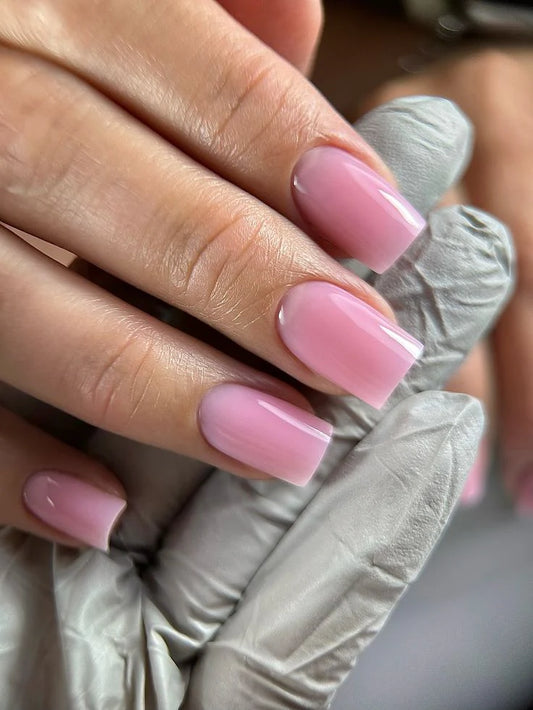 Nails finished with Base One Brush One Bottle Gel (15g) in Sassy Flirt, displaying a smooth, opaque, sweet light pink manicure for a fresh, fashionable look.