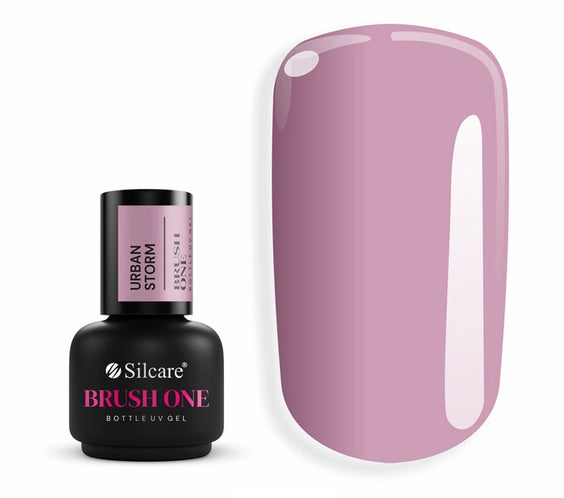 Brush One Bottle Gel (15g) in Urban Storm, set next to a large nail tip, displaying the opaque, dark dusty pink color with violet undertones.