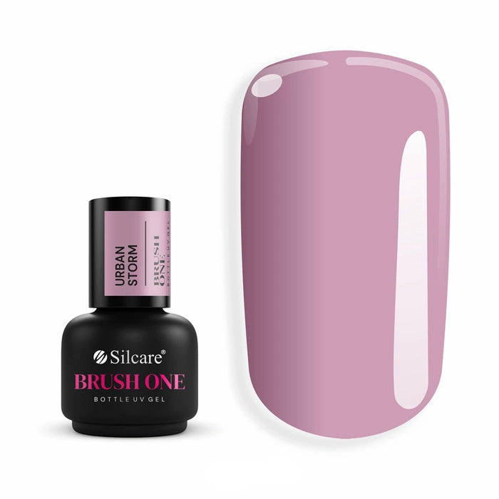 Brush One Bottle Gel (15g) in Urban Storm, set next to a large nail tip, displaying the opaque, dark dusty pink color with violet undertones.