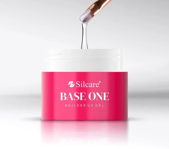 Nail brush holding a small, controlled bead of the self-leveling UV building gel, demonstrating its medium-thick viscosity for precise application.