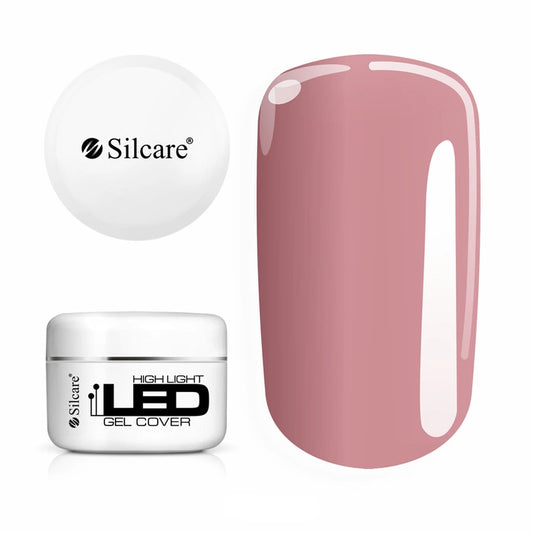 Jar of High Light LED Cover Builder Gel (100g), set next to a nail tip, displaying the opaque, natural nude pink color for nail bed extensions.