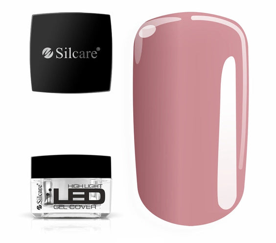 Jar of High Light LED Cover Builder Gel (15g), set next to a nail tip, displaying the opaque, natural nude pink color for nail bed extensions.