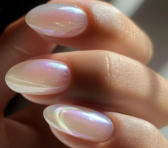 Nails finished with High Light LED Aura Milky Builder Gel (15g), displaying a smooth, milky white manicure with a beautiful pearl sheen and subtle sparkle.