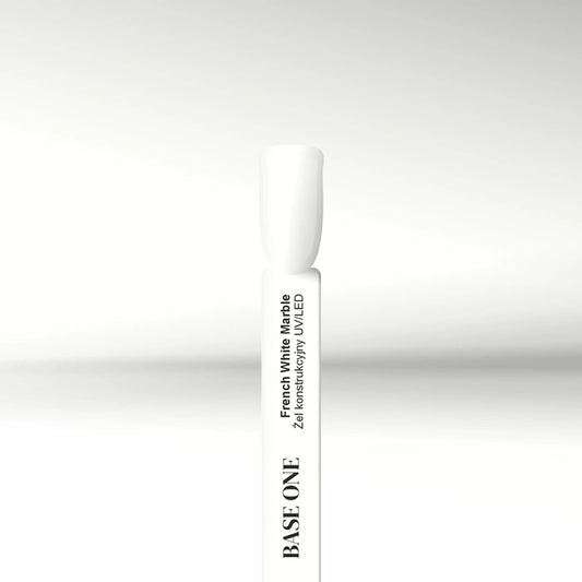 Cured nail tip displaying the warm white Base One French White Marble UV builder gel (15g), providing opaque coverage ideal for soft French tips.