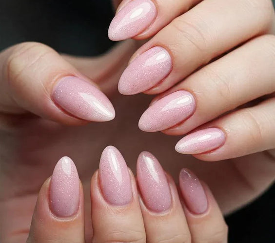 Nails finished with Base One Shimmer Misty Rose UV builder gel (15g), displaying a smooth, opaque dusty rose manicure with fine, light-reflecting shimmer.