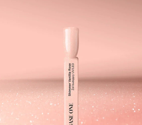 Cured nail tip displaying the shimmery, soft Vanillia Rose color of the Base One UV builder gel (15g), perfect for a sparkling natural base.