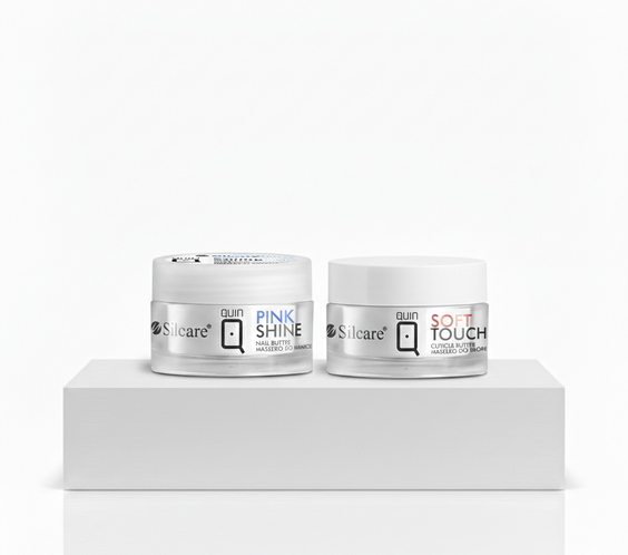 Two jars of Silcare Quin Nail Butter, Pink Shine and Soft Touch, displayed as a manicure bundle on a white podium. High-quality professional nail care and cuticle treatment products for salon-quality results.
