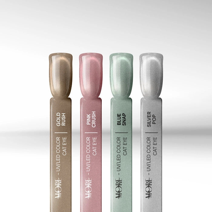 Four nail swatch sticks comparing Silcare maniMORE Cat Eye gel polish shades: Gold Rush, Pink Crush, Blue Snap, and Silver Pop, highlighting the metallic magnetic shimmer of each color.