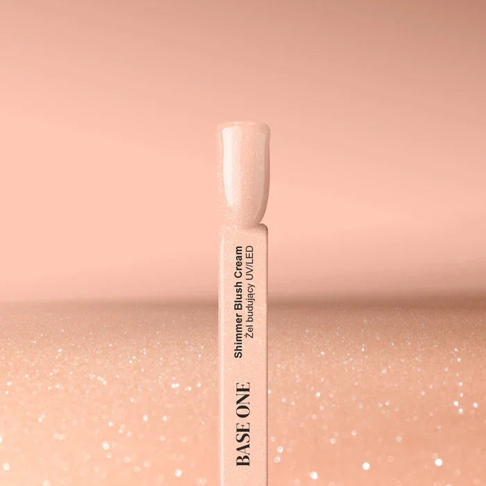 Apricot pink shimmer builder gel nail swatch with fine glitter particles on display stick – Shimmer Blush Cream UV builder gel for nail extensions | Silcare Base One