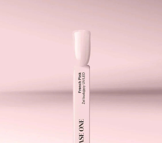 French Pink Silcare Base One Builder UV/LED Gel swatch stick displaying a soft pale pink nail shade, photographed on a pastel pink background with clean minimal product styling.