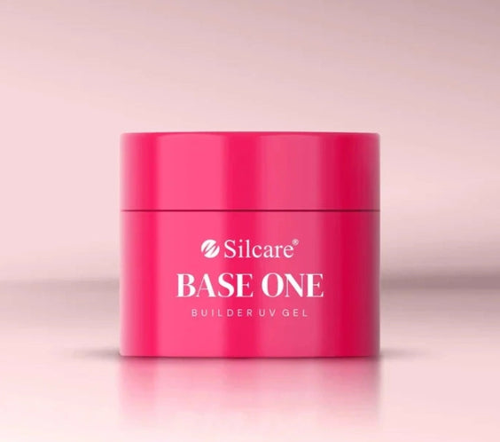 French Pink Silcare Base One Builder UV Gel in bright pink jar packaging, photographed on a soft pastel pink background with clean minimal studio lighting, showcasing professional nail builder gel product.