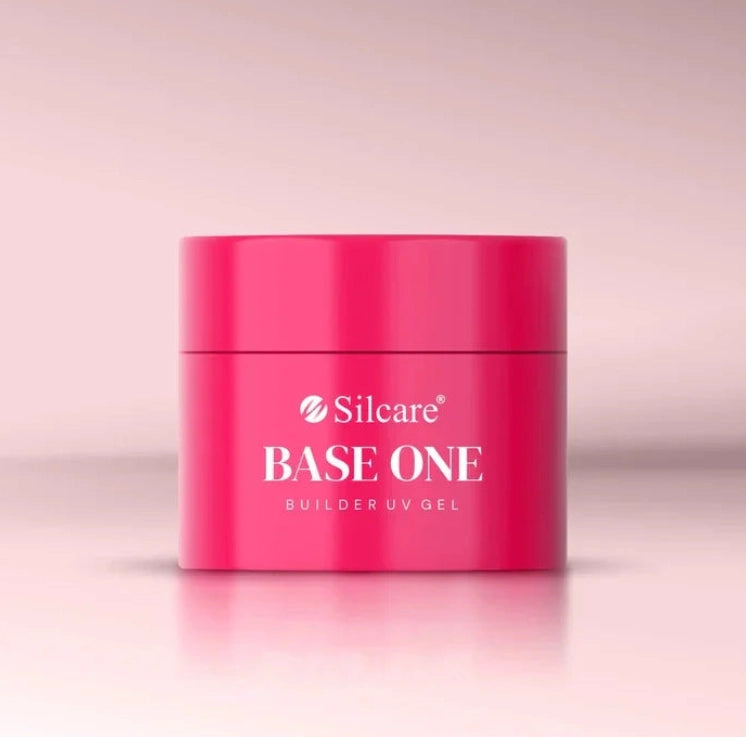 French Pink Silcare Base One Builder UV Gel in bright pink jar packaging, photographed on a soft pastel pink background with clean minimal studio lighting, showcasing professional nail builder gel product.