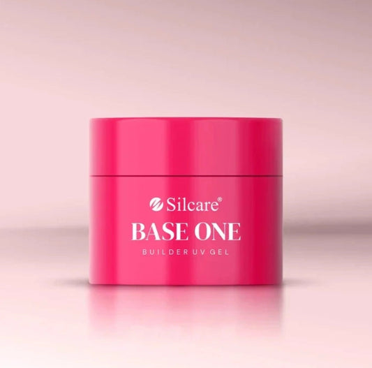 French Pink Silcare Base One Builder UV Gel in bright pink jar packaging, photographed on a soft pastel pink background with clean minimal studio lighting, showcasing professional nail builder gel product.