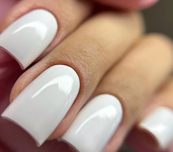 French White Marble Base One Silcare: High-shine white gel manicure on square-shaped nails.