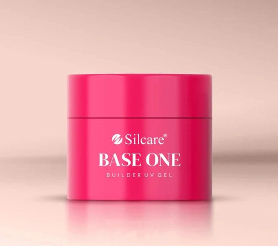 Silcare Base One Builder Gel Cover Light in bright pink jar packaging, photographed on a soft neutral background with clean studio lighting, showcasing professional nail builder gel product for natural-looking nail coverage.