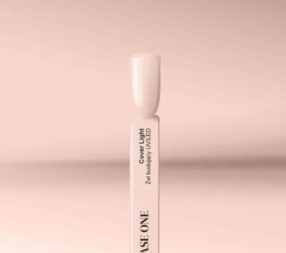 Silcare Base One Builder Gel Cover Light swatch stick displaying a creamy nude beige shade on a soft pastel background, showing smooth opaque colour, natural nail tone, and glossy finish for professional nail application.
