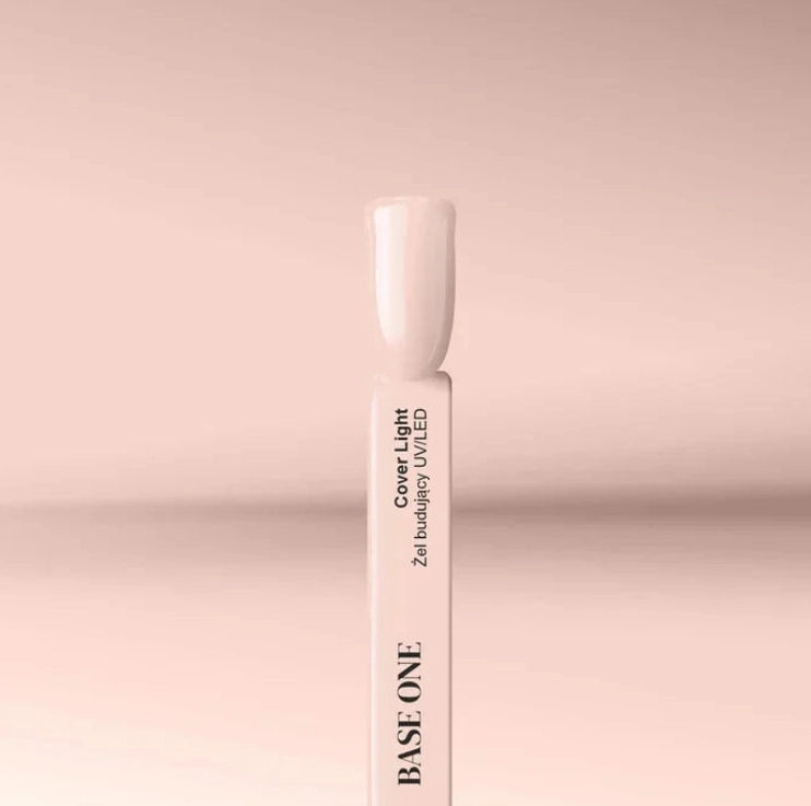 Silcare Base One Builder Gel Cover Light swatch stick displaying a creamy nude beige shade on a soft pastel background, showing smooth opaque colour, natural nail tone, and glossy finish for professional nail application.