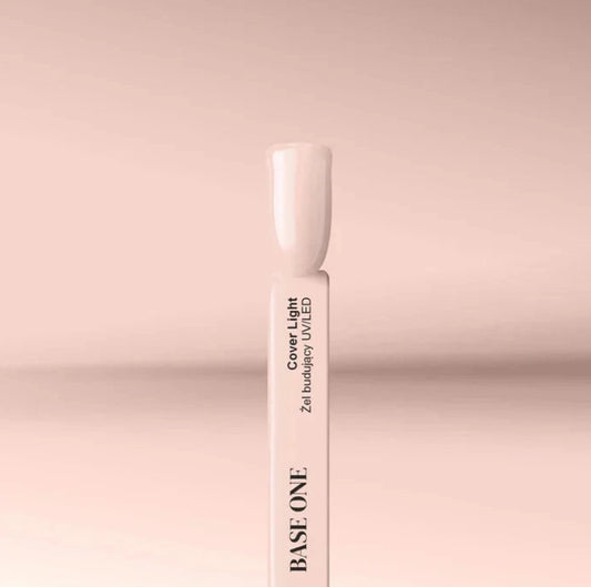 Silcare Base One Builder Gel Cover Light swatch stick displaying a creamy nude beige shade on a soft pastel background, showing smooth opaque colour, natural nail tone, and glossy finish for professional nail application.