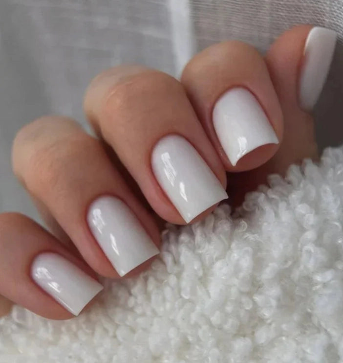 Silcare Base One Builder Gel Milkshake on short square nails, showcasing a glossy milky white manicure with full coverage, smooth self-levelling finish and professional UV LED builder gel for elegant nail overlays and extensions.
