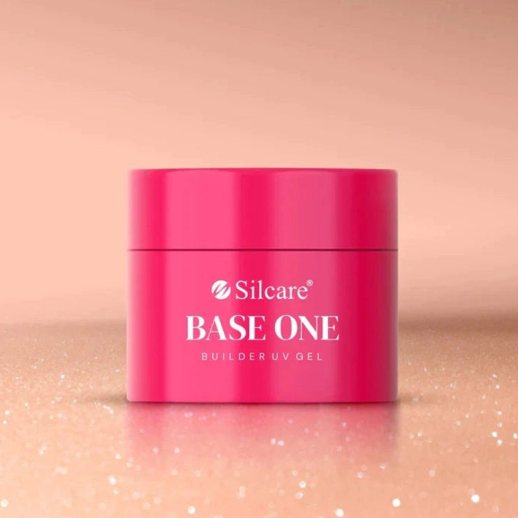 Silcare Base One Builder Gel Shimmer Blush Cream professional builder gel jar with a soft blush pink shimmer background, showcasing a self-levelling UV LED builder gel for natural nail overlays, durable extensions and salon-quality manicures in Australia.