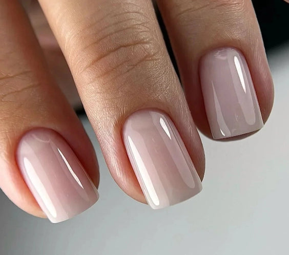Silcare Base One Builder Gel Vanillia Rose on short square-shaped nails in a close-up view, showing soft nude pink colour with high-gloss shine, smooth even coverage, and clean natural salon-quality manicure finish.