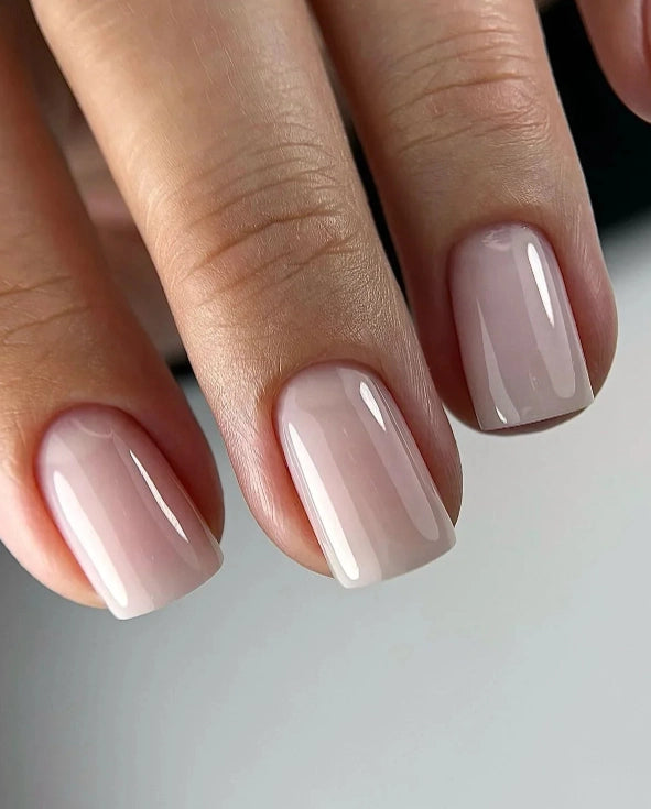 Silcare Base One Builder Gel Vanillia Rose on short square-shaped nails in a close-up view, showing soft nude pink colour with high-gloss shine, smooth even coverage, and clean natural salon-quality manicure finish.