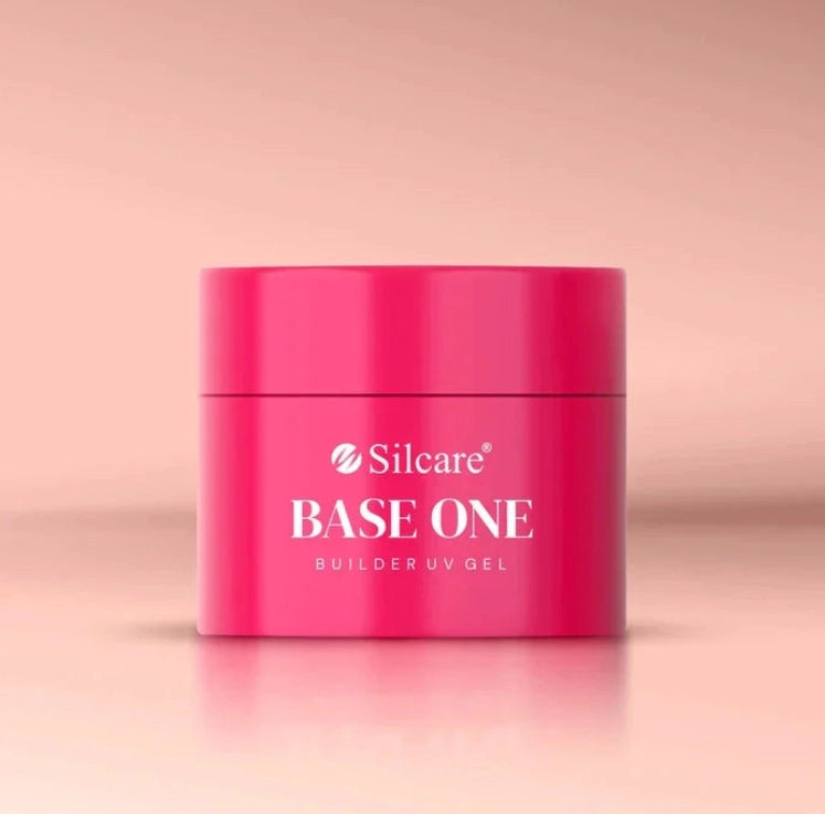 Silcare Base One Builder Gel Vanillia Rose in bright pink jar packaging on a soft pastel background, showcasing professional UV builder gel product with sleek design, ideal for natural nude pink manicures and salon-quality nail enhancements.