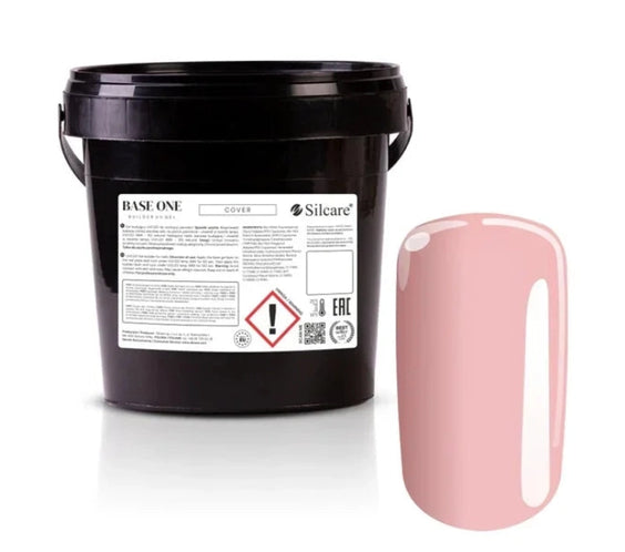 Silcare Base One Cover builder UV gel in large black bucket packaging with label and nude beige nail swatch showing smooth glossy coverage and natural finish