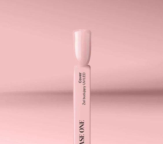 Silcare Base One Cover builder UV LED gel swatch stick with nude beige nail tip on pink background, showing smooth glossy coverage and natural tone finish
