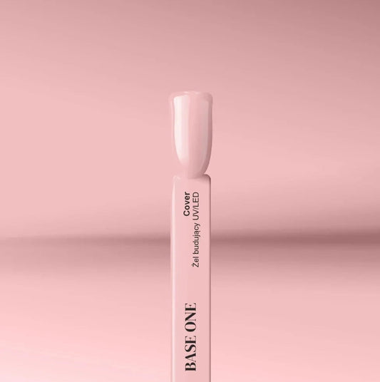 Silcare Base One Cover builder UV LED gel swatch stick with nude beige nail tip on pink background, showing smooth glossy coverage and natural tone finish