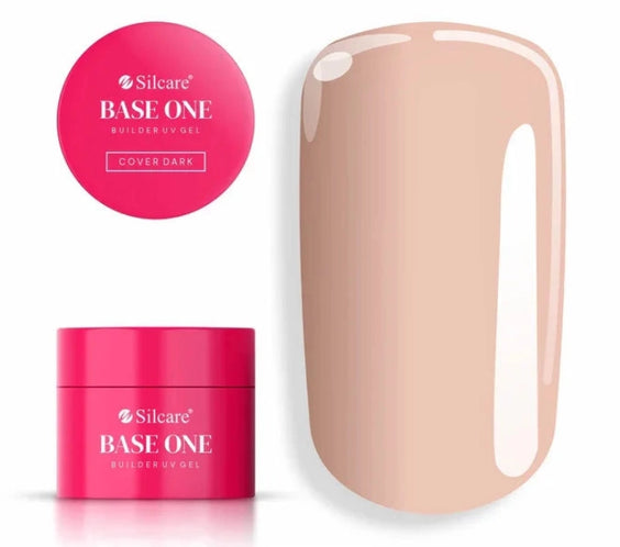 Silcare Base One Cover Dark Builder UV Gel in a bright pink jar with the product lid displayed above and a glossy nude beige nail swatch beside it, showing the natural camouflage shade of the builder gel used for nail extensions, nail bed enhancement, overlays, and professional salon manicures.