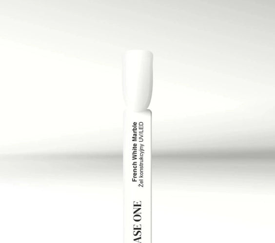Close-up of the Silcare Base One French White Marble Builder UV/LED Gel colour swatch displayed on a white sample stick. The glossy milky white shade is shown against a clean white background, highlighting the builder gel's elegant French white finish for French manicures, baby boomer nails, nail extensions, overlays, and professional salon nail enhancements.