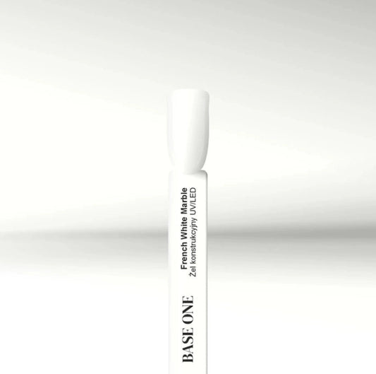 Close-up of the Silcare Base One French White Marble Builder UV/LED Gel colour swatch displayed on a white sample stick. The glossy milky white shade is shown against a clean white background, highlighting the builder gel's elegant French white finish for French manicures, baby boomer nails, nail extensions, overlays, and professional salon nail enhancements.