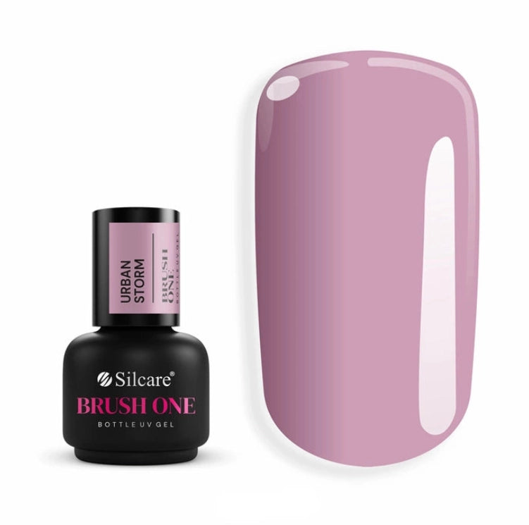 Silcare Brush One Urban Storm BIAB Builder Gel bottle displayed beside a glossy nail colour swatch in a sophisticated muted lilac-grey shade. Professional self-levelling builder gel with a cool-toned mauve finish, ideal for natural nail strengthening, overlays and elegant modern manicures.