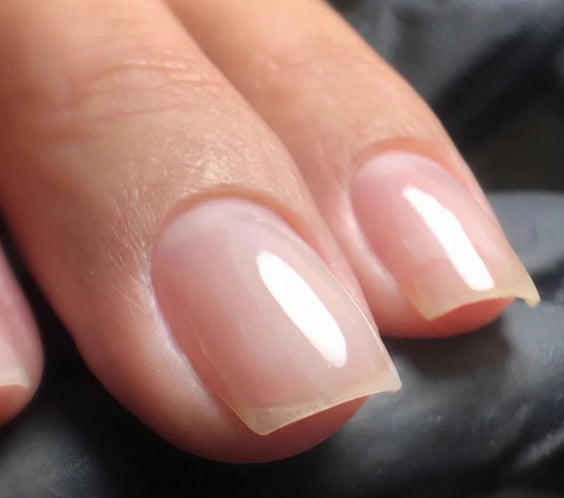 Close-up of natural nails finished with Silcare High Light LED Blue UV/LED builder gel, showcasing a crystal-clear transparent finish with a smooth high-gloss surface that enhances the natural nail. Professional self-levelling builder gel for overlays, nail strengthening, extensions and salon-quality manicures – Silcare Australia.